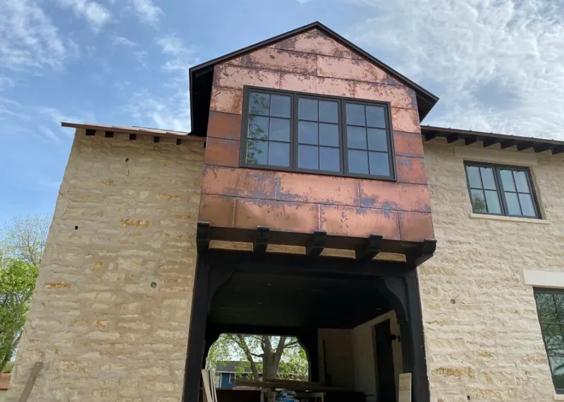 Copper metal panel facade on a stone building for Roof Repair in Lakewood Ranch