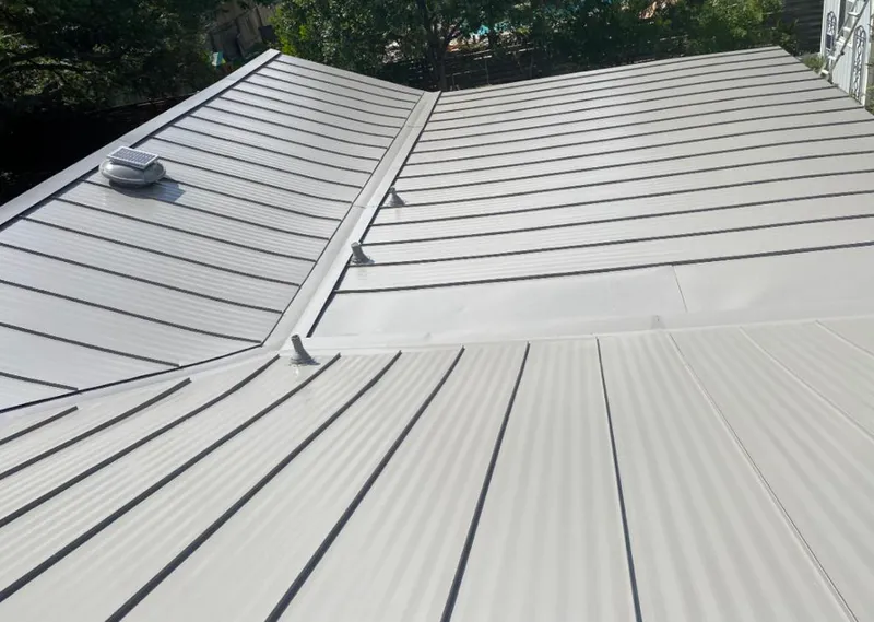 Solar attic fan installed on a metal roof for Roof Ventilation in Lakewood Ranch
